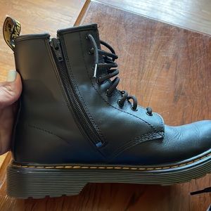 Doc Marten’s women’s combat boot with a side zip.